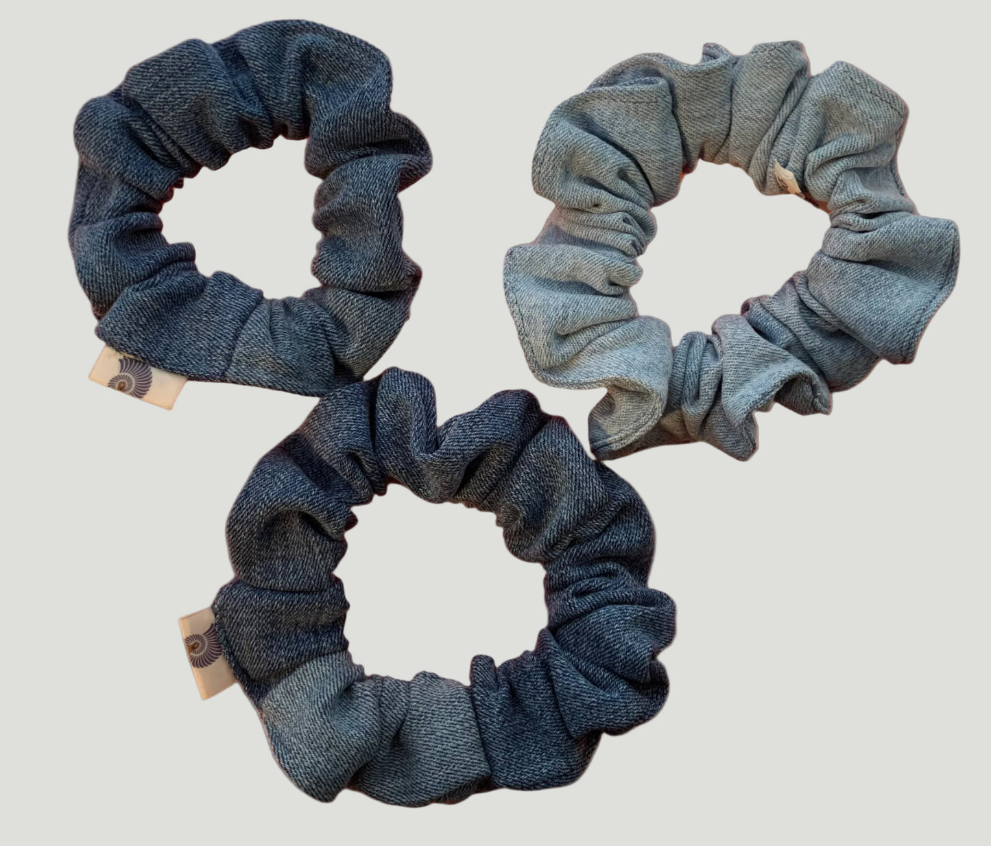 three scrunchies on a beige background (backside)